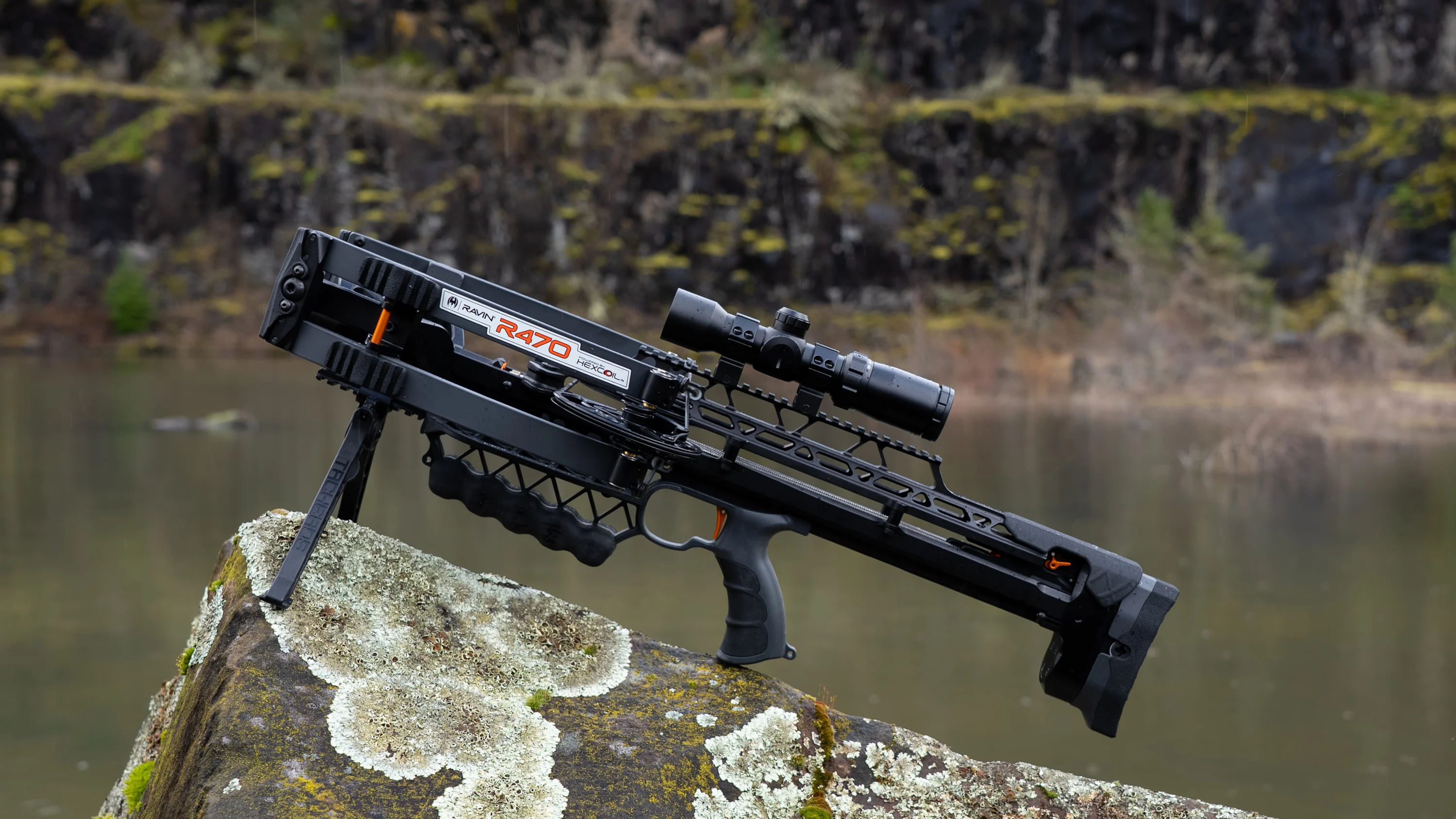 The new Ravin R470 on a rock in the woods near a pond.