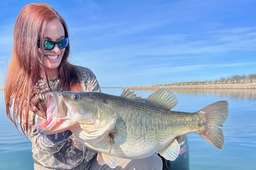 A bass angler poses with a 12-pounds largemouth.