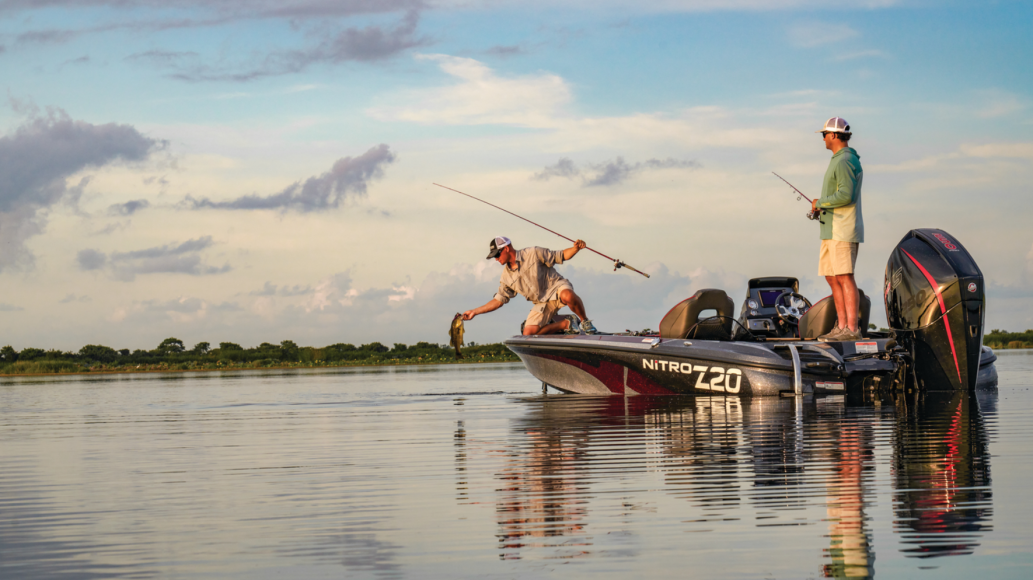 Two anglers catching fish on Bass Pro Shops Nitro Z20 boat