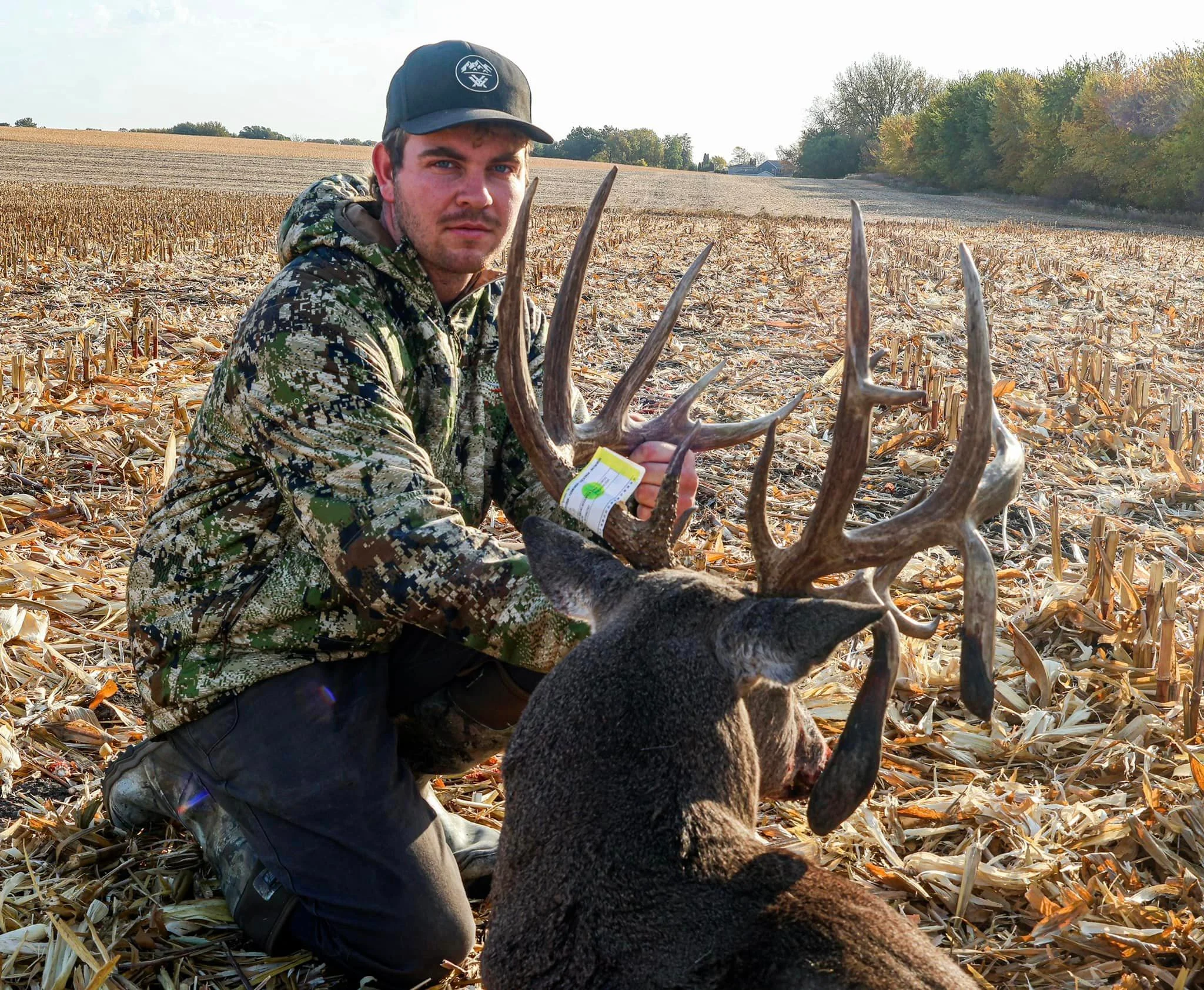 An Iowa bowhunter displays the backside of an enormous whitetail's non-typical rack. 