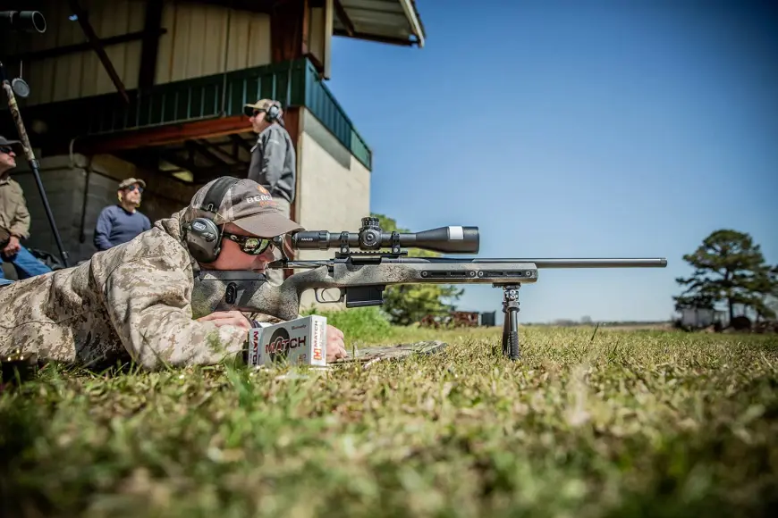 Man aiming rifle