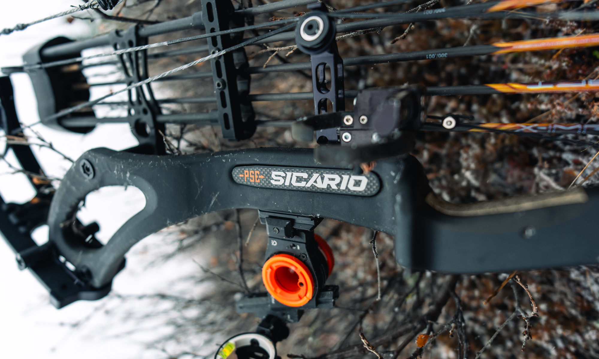 A closeup of the riser and logo of the new PSE Sicario compound bow.
