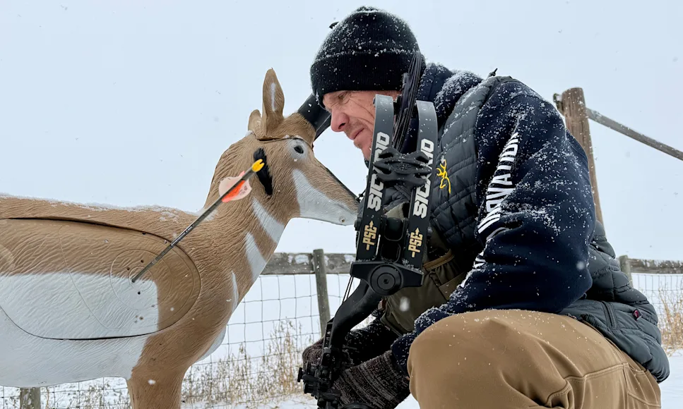 An archer admires a perfect shot on a 3D pronghorn target, fired with the new PSE Sicario compound bow.