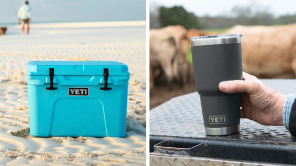 Yeti Tundra cooler sitting on the beach and man holding Yeti Rambler tumbler