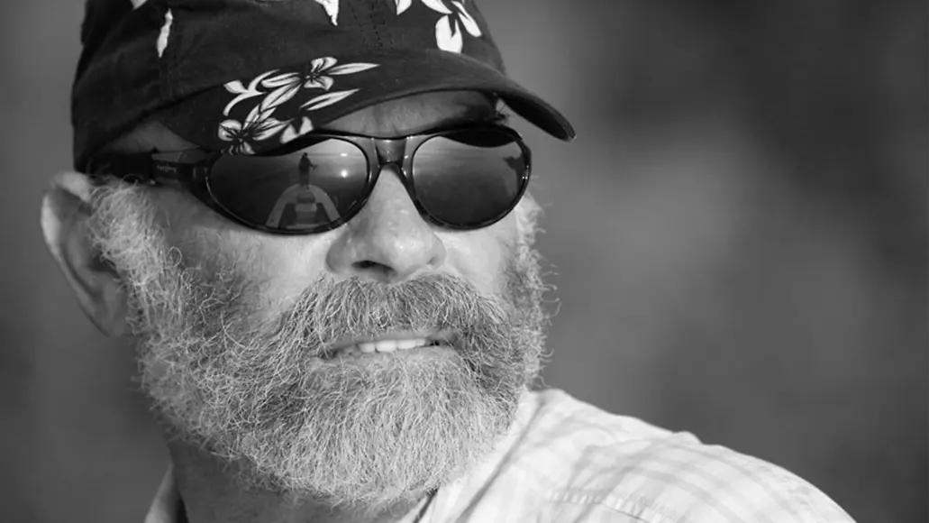 Portrait of outdoor TV personality Flip Pallot in sunglasses.