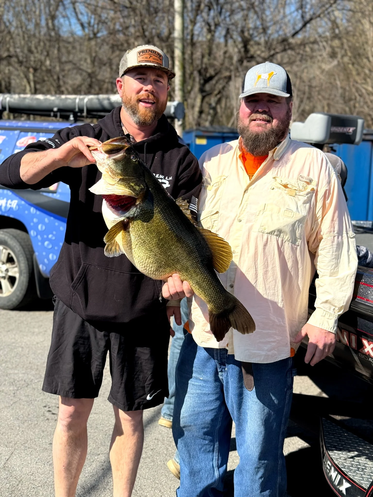 An angler poses alongside the pending state-record Tennessee largemouth.