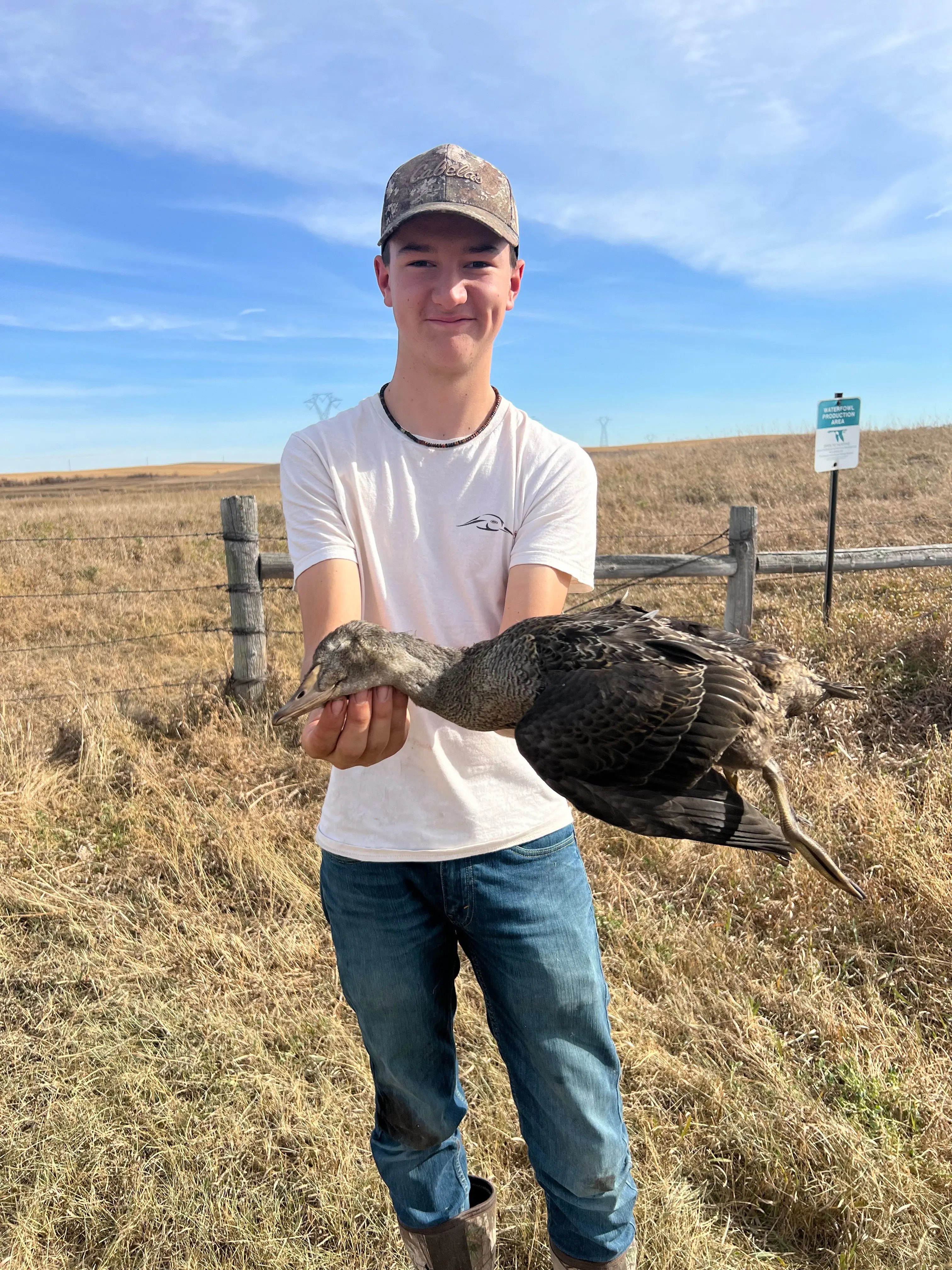 A South Dakota waterfowl hunter poses with a rare king eider duck. 