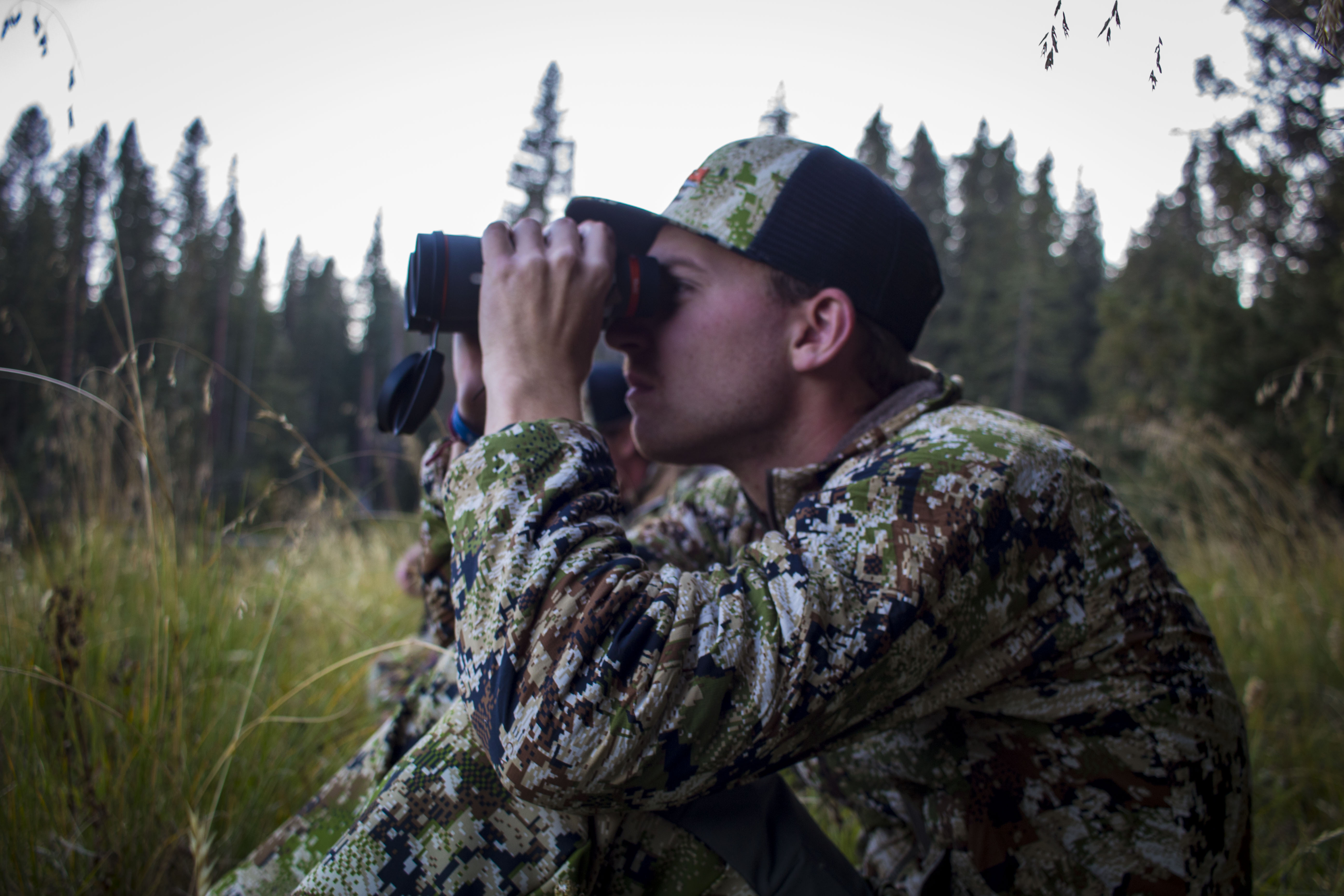 Hunter looking through binos