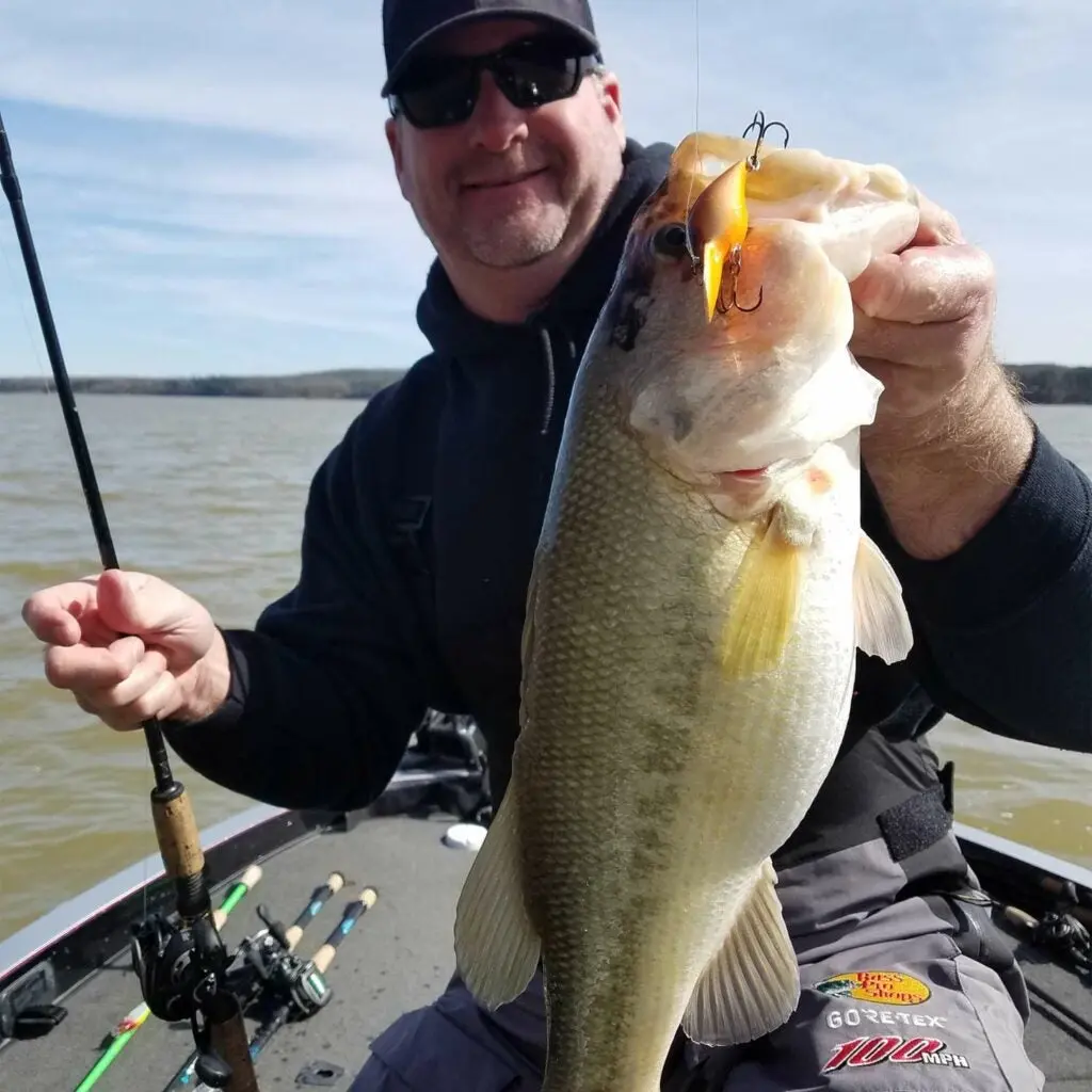 Steve madar holding a largemouth bass.