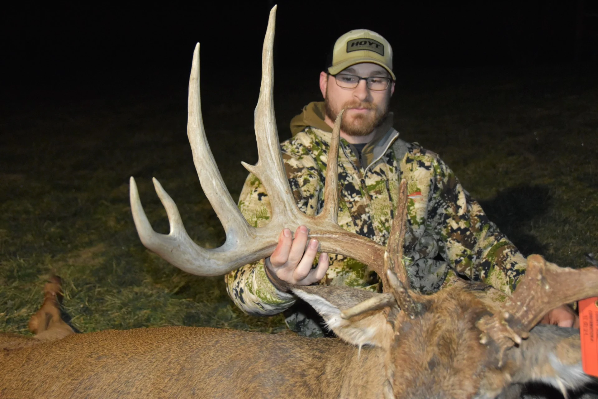 A hunter poses with a trophy whitetail taken in Ohio. 