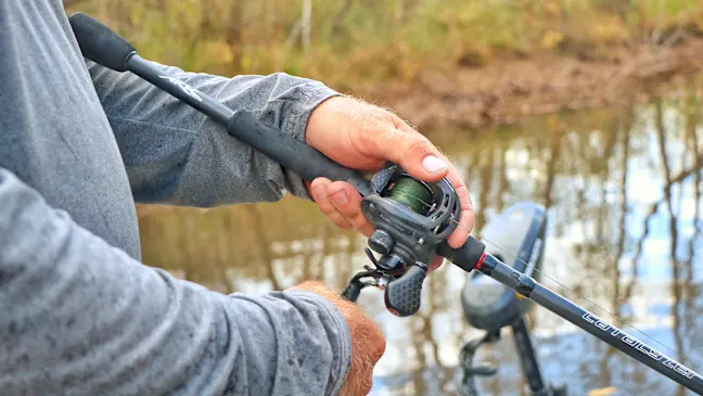 Angler reeling in lure on the Ark Catalyzer rod