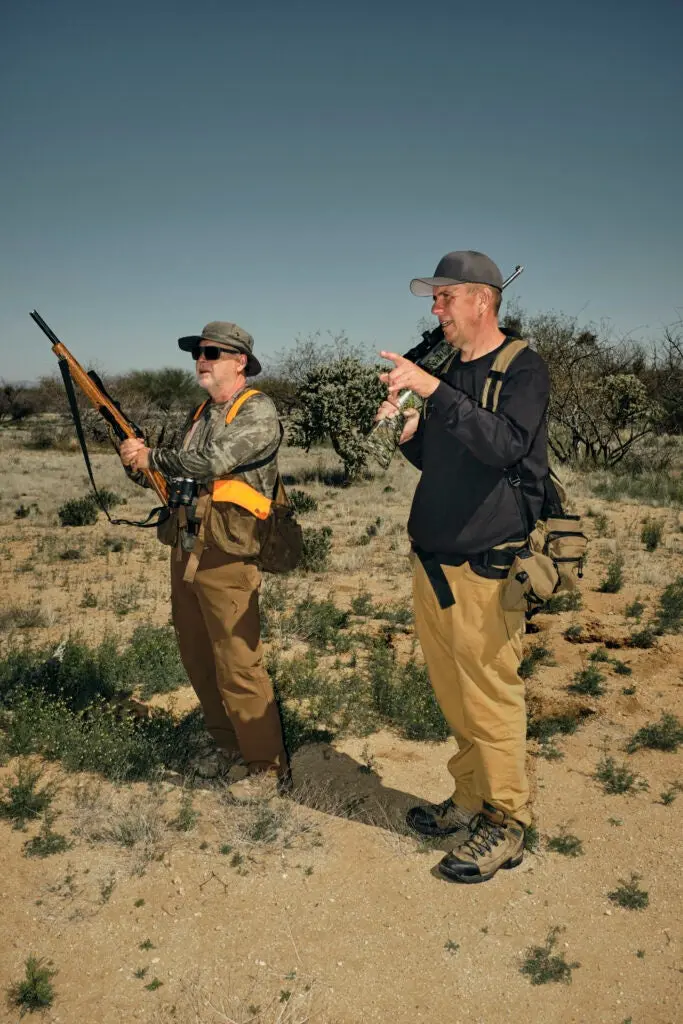 two hunters hunting jackrabbits