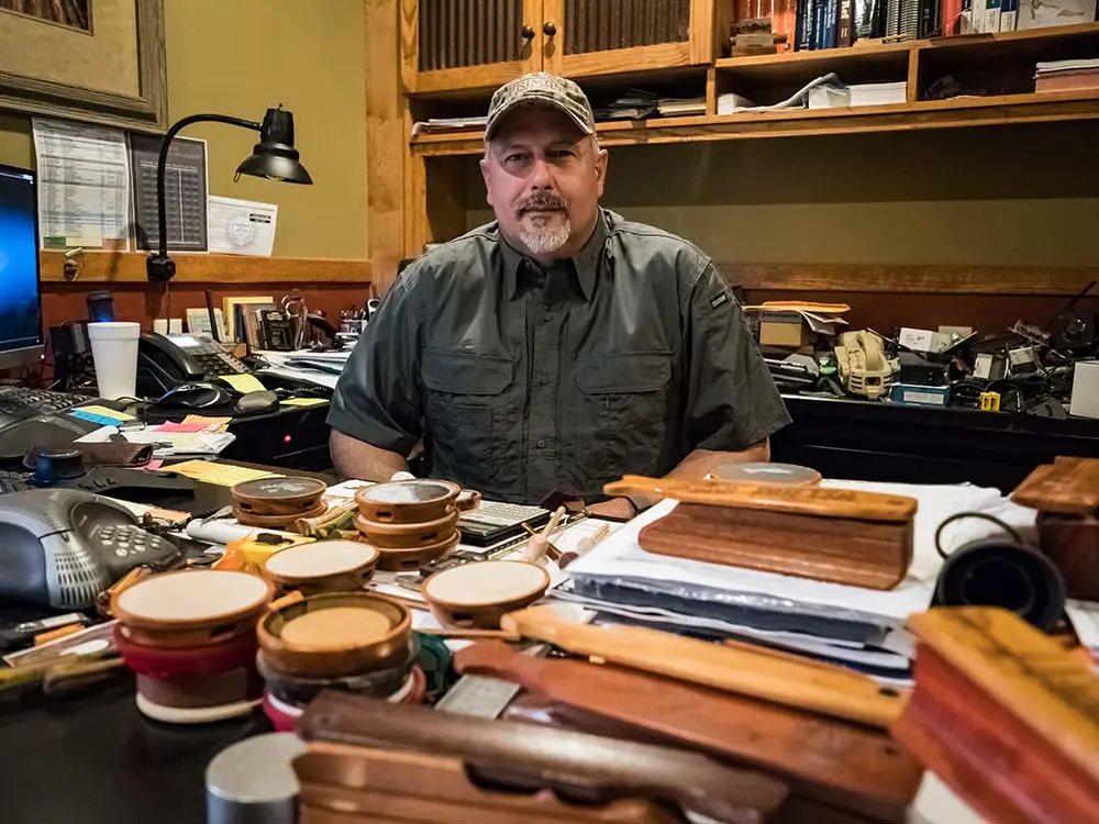 Primos game calls desk covered in turkey calls