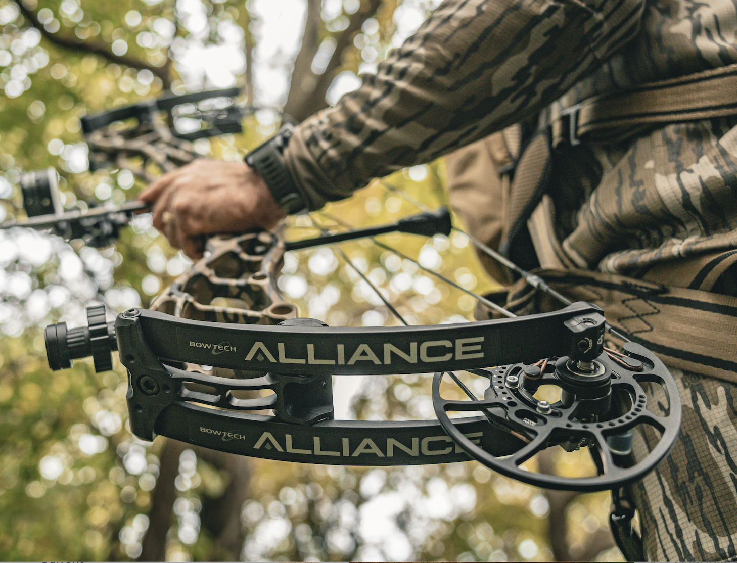 A hunter holds the new Bowtech Alliance compound bow. 
