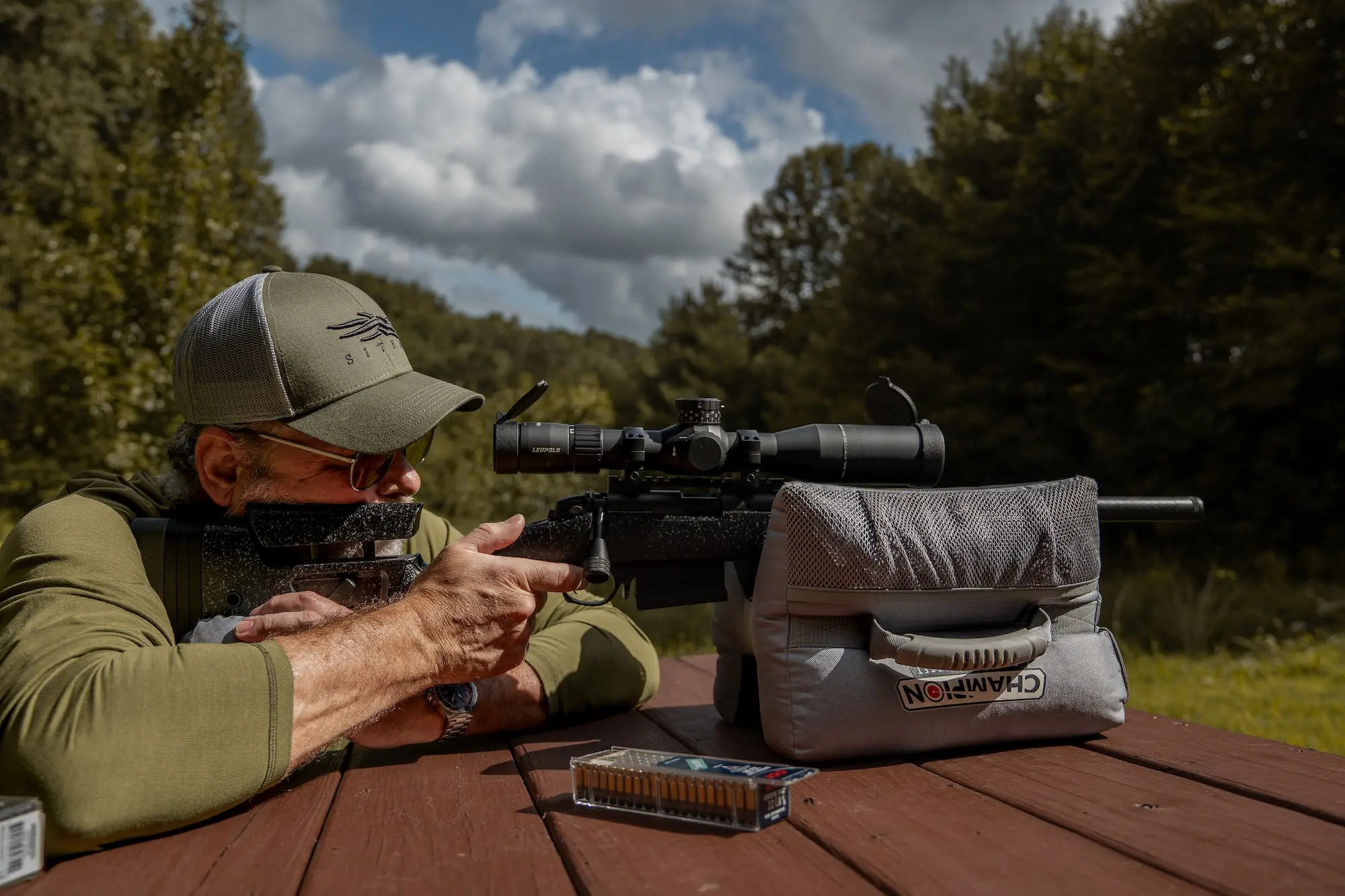 Man shooting the Bergara B-14R rifle.