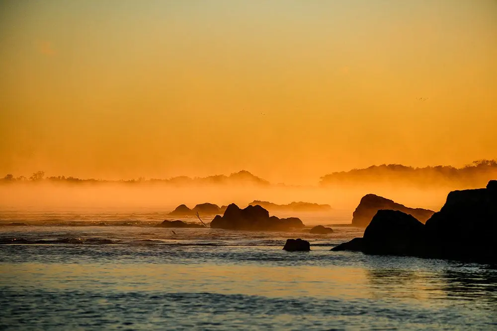 a golden sunset over the upper parana river