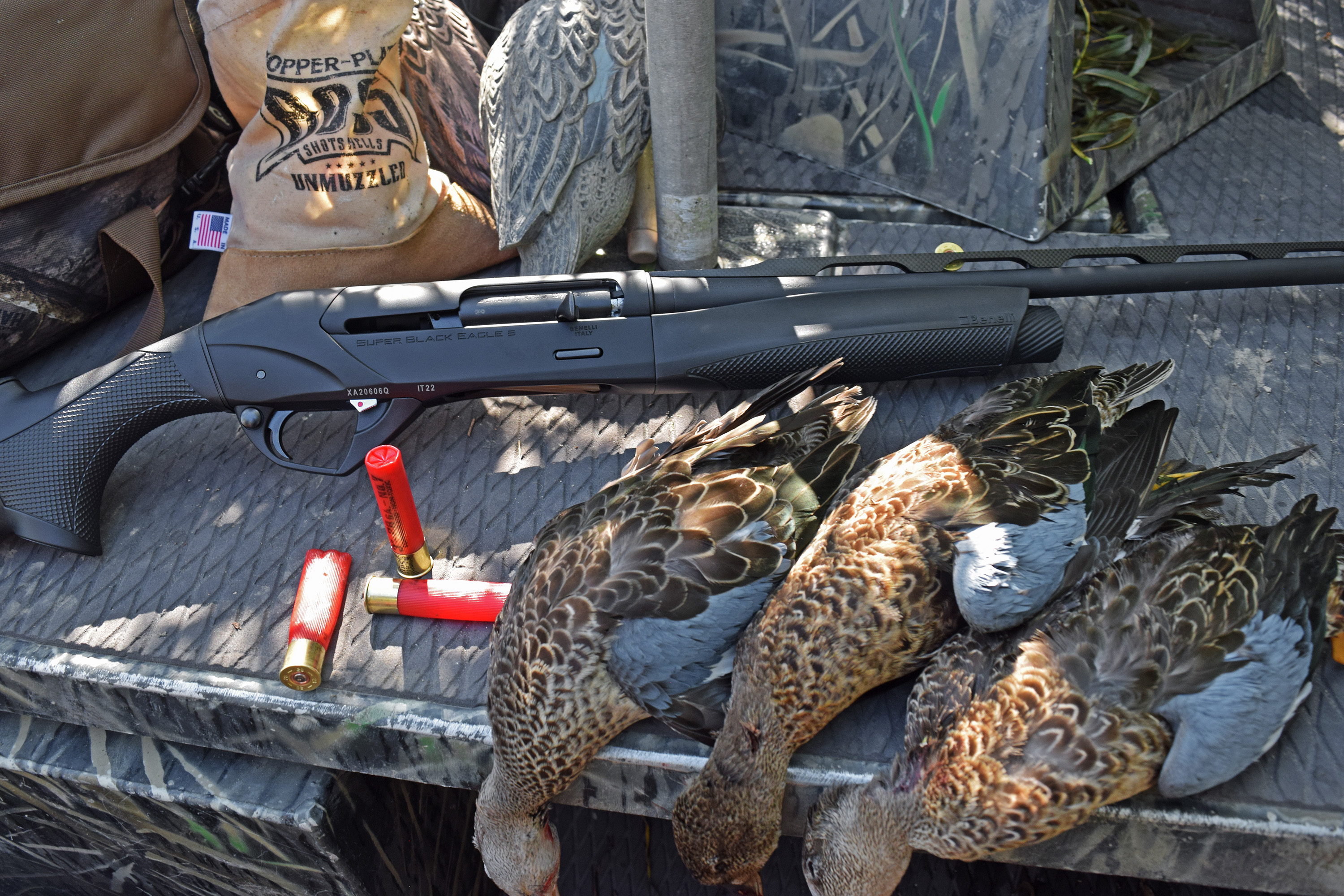 Benelli Super Black Eagle 28-gauge next to teal ducks