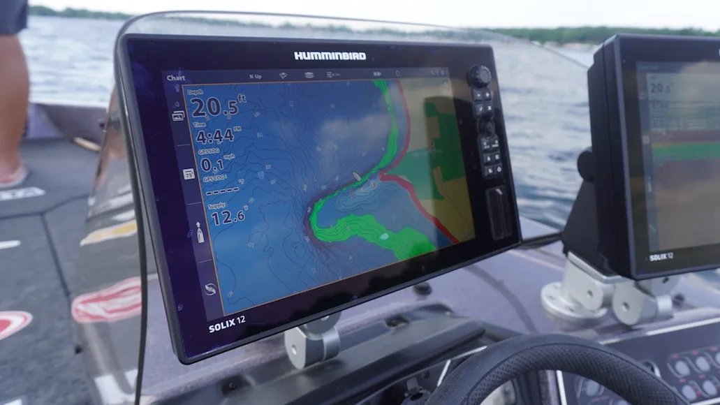 Humminbird Solix 12 Fish Finder mounted on front of fishing boat