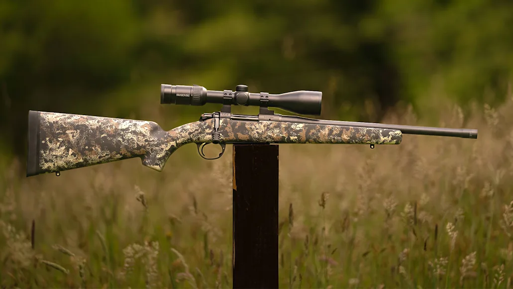 The new Wilson Combat Model 20S bolt-action rifle balance on a post in a field.