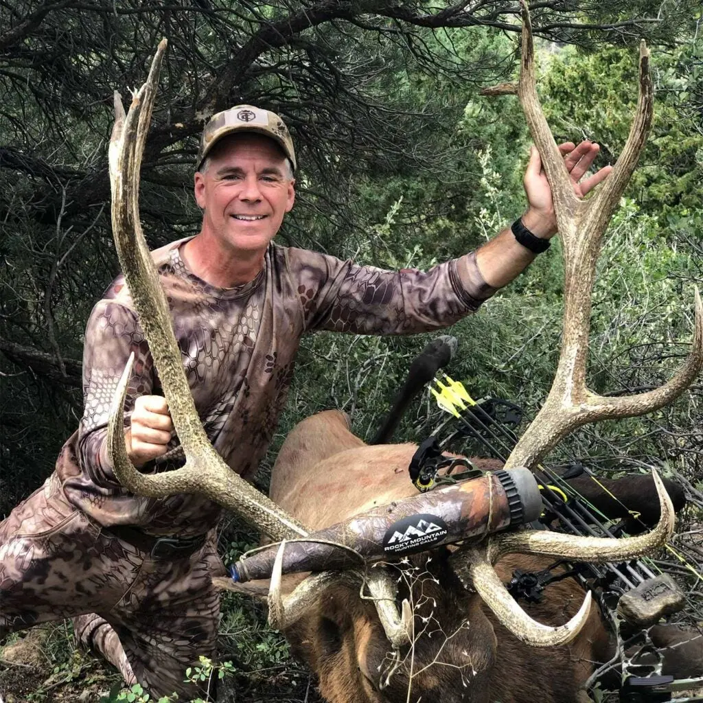 a colorado bull elk and hunter