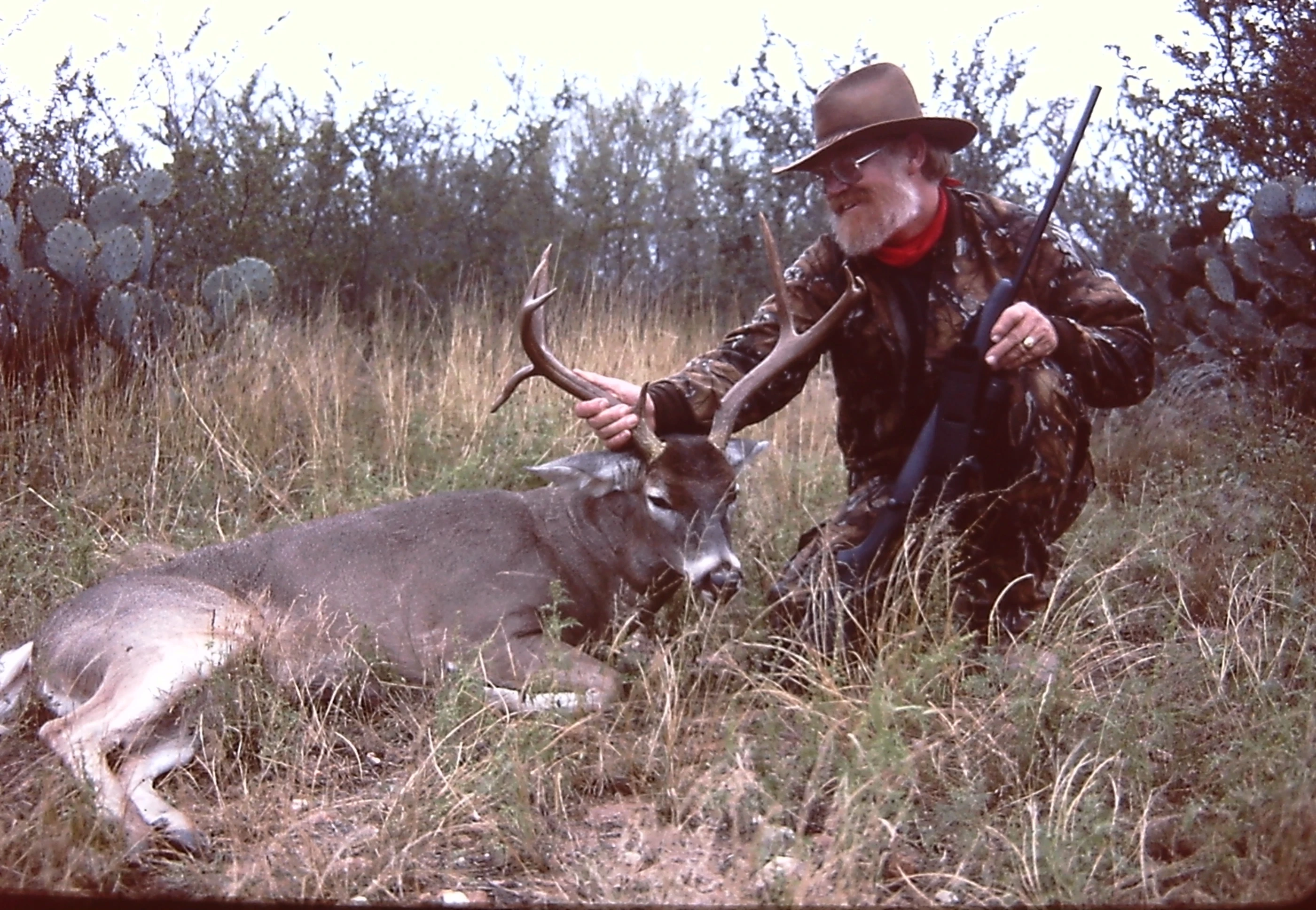 Well known Texas hunter Larry Weishuhn poses with a nice whitetail buck. 