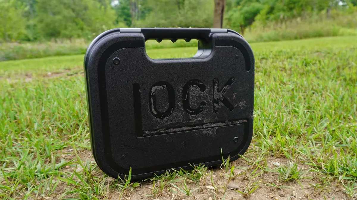 Glock hard pistol case on grass