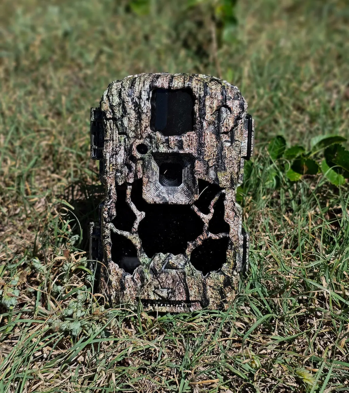 Stealthcam Prevue 26 trail camera sitting on grass