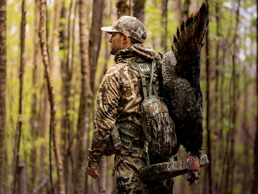 hunter with turkey and M2 turkey vest