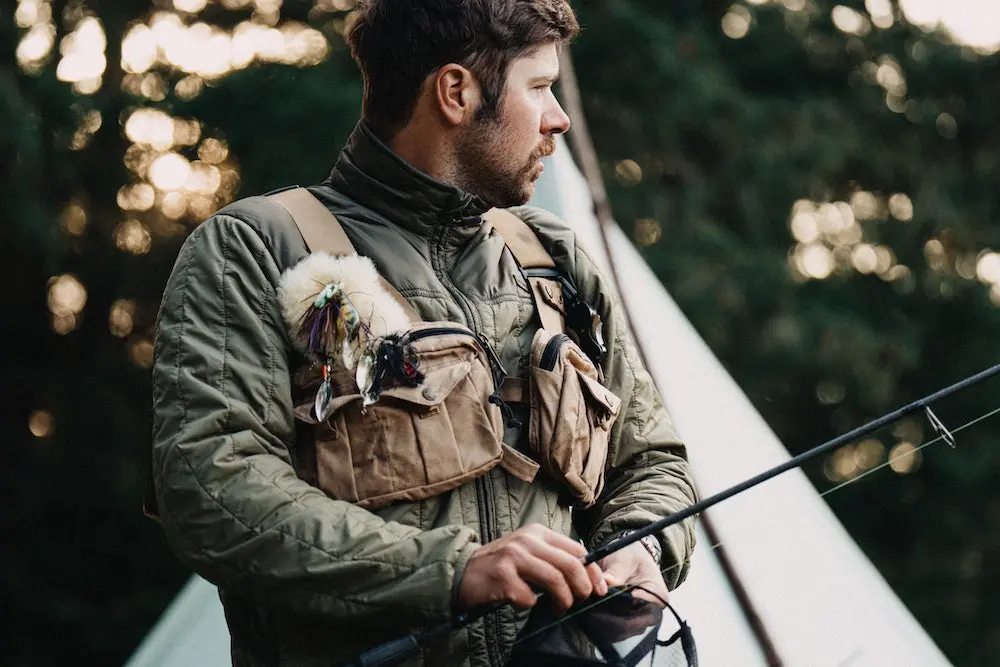 Fisherman wearing Filson vest