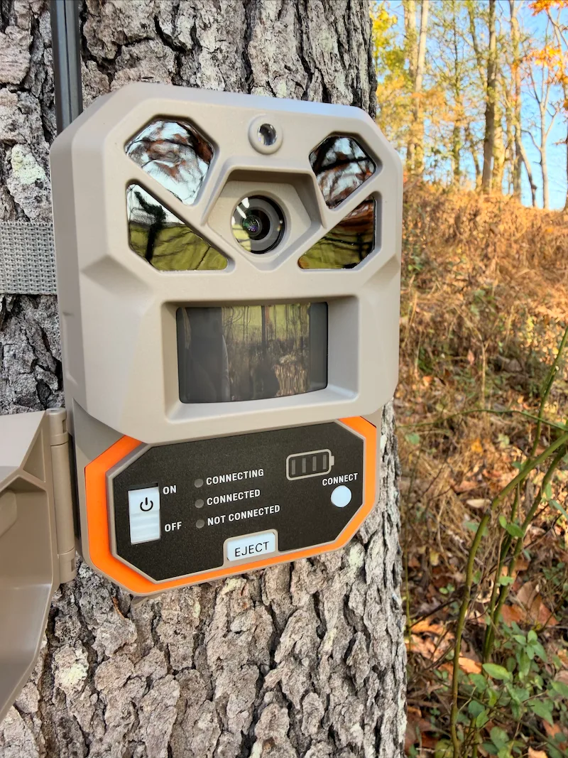 Moultrie Edge 3 Pro mounted on tree with control panel open