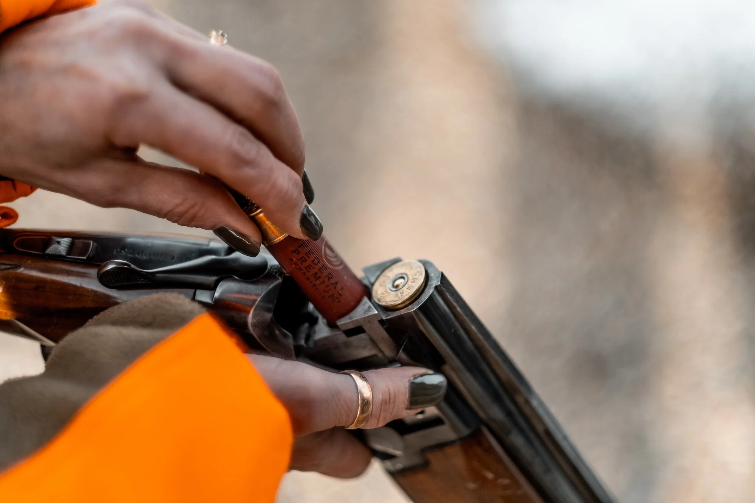 Loading a break-action shotgun.