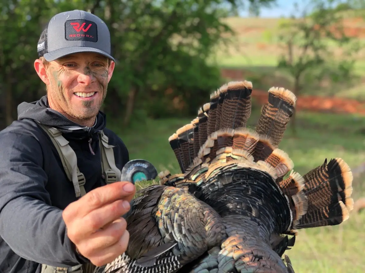 Turkey hunter holding WoodHaven Ninja Ghost mouth call