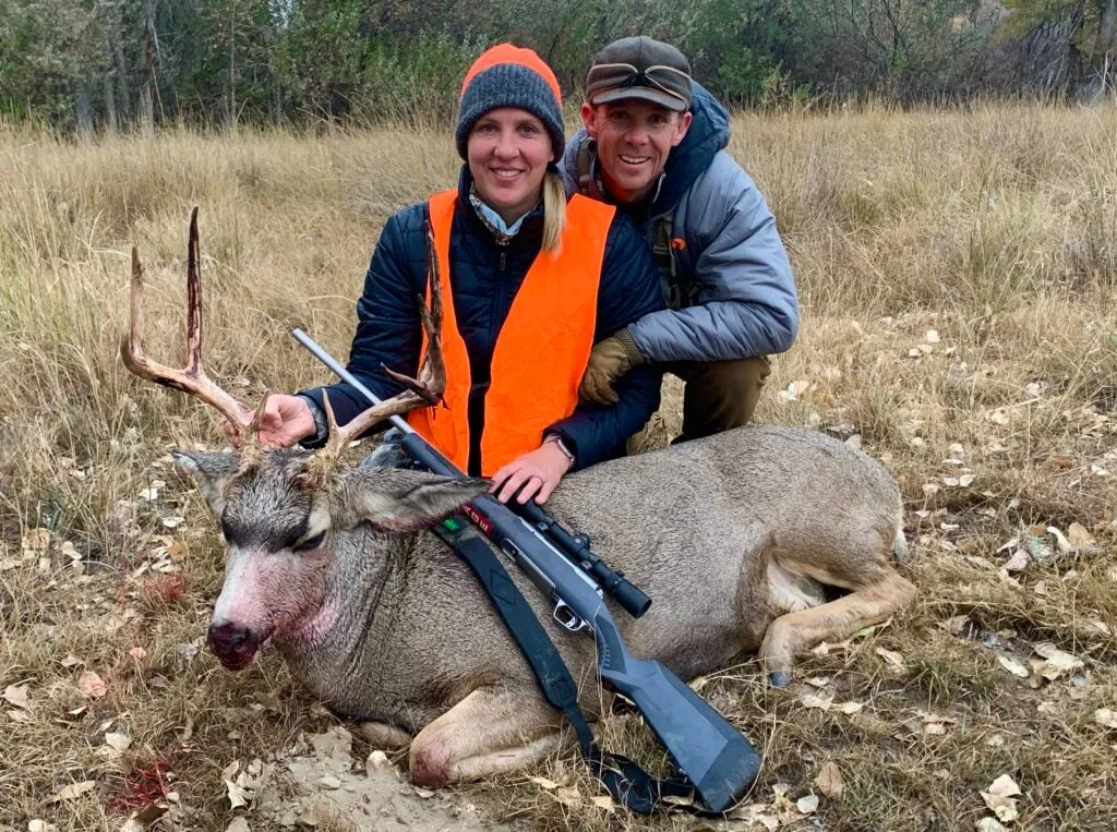 Author and wife with mule deer