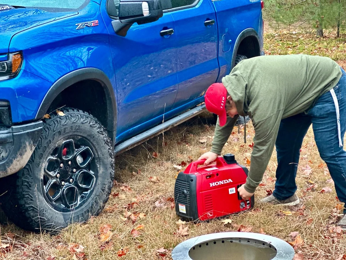 The author's son starting a Honda generator 