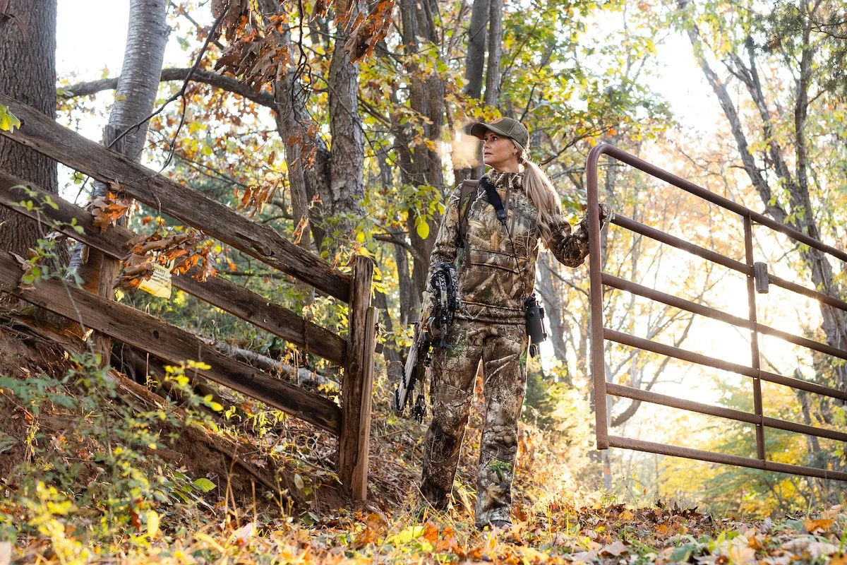 Female bowhunter wearing DSG Outerwear in the field