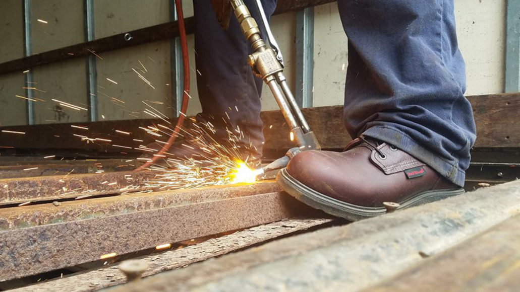 Construction worker wearing Red Wing work boots