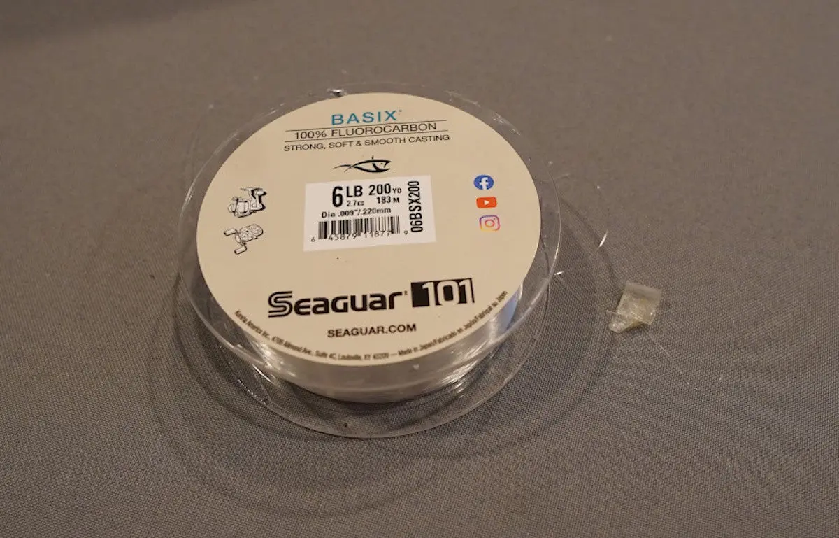 Seaguar Basix Fluorocarbon Fishing line spool sitting on table