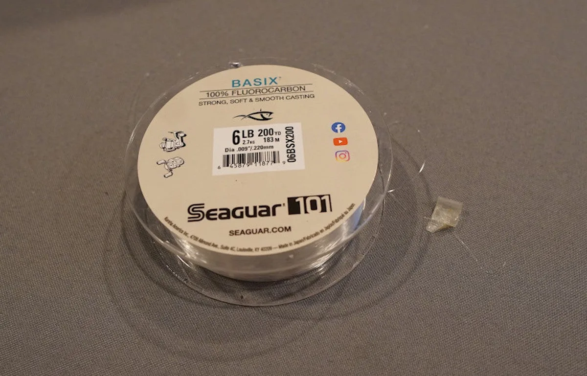 Seaguar Basix Fluorocarbon Fishing line spool sitting on table