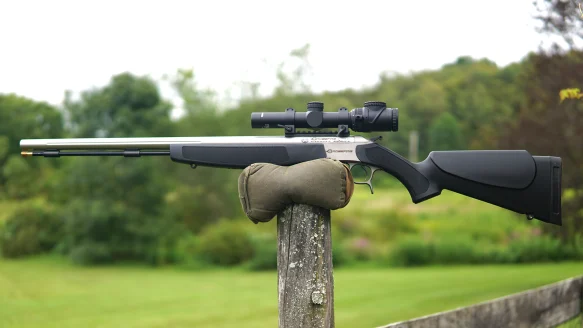 The new CVA Crossfire muzzleloader balanced on a fence post. 