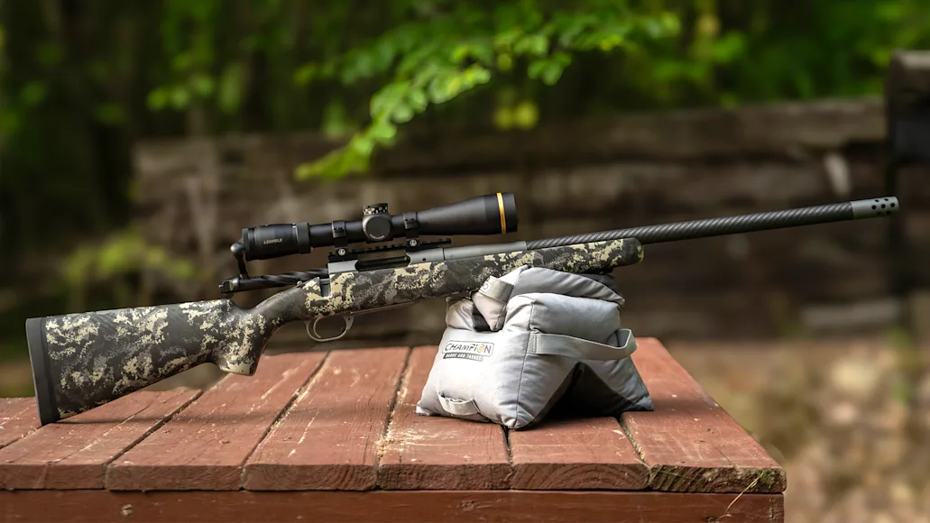 The Springfield Armory Model 2020 Boundary bolt-action rifle on sandbags on a bench.
