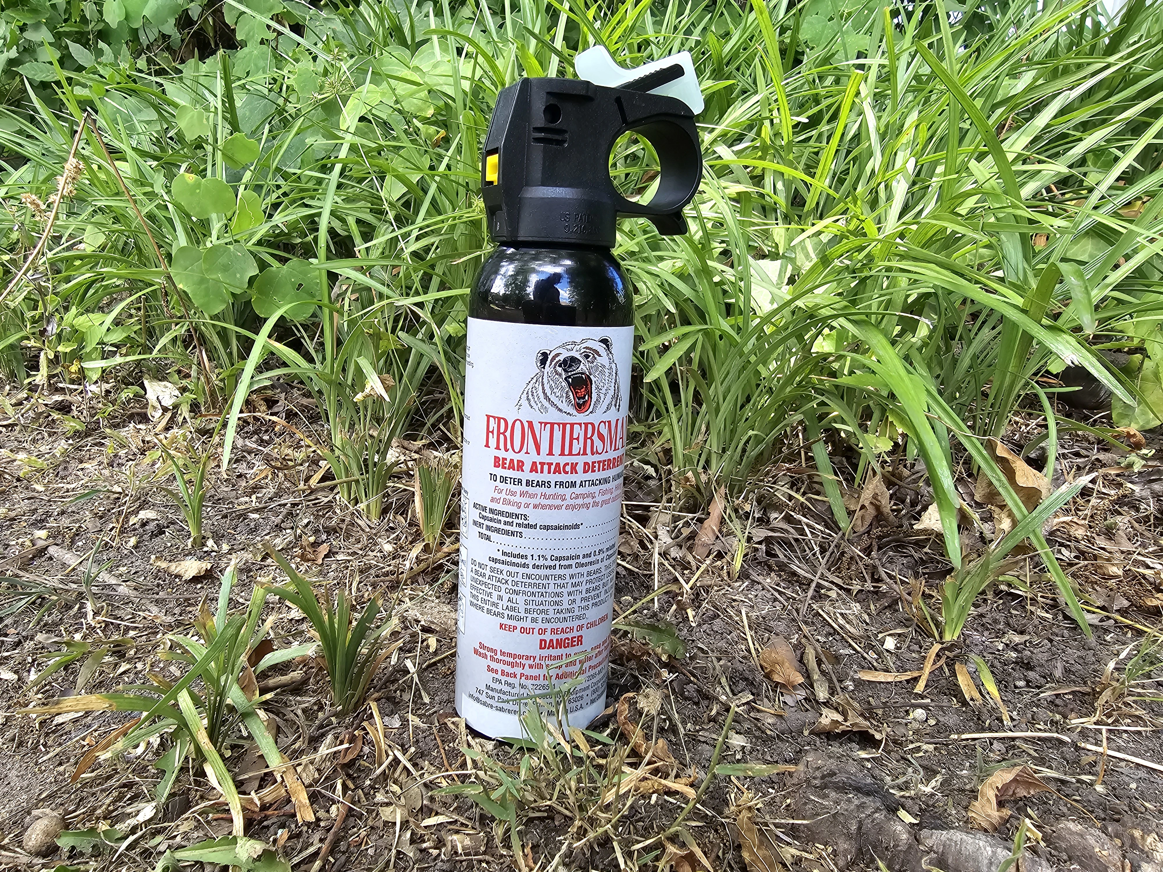 Frontiersman Bear Spray sitting on grass