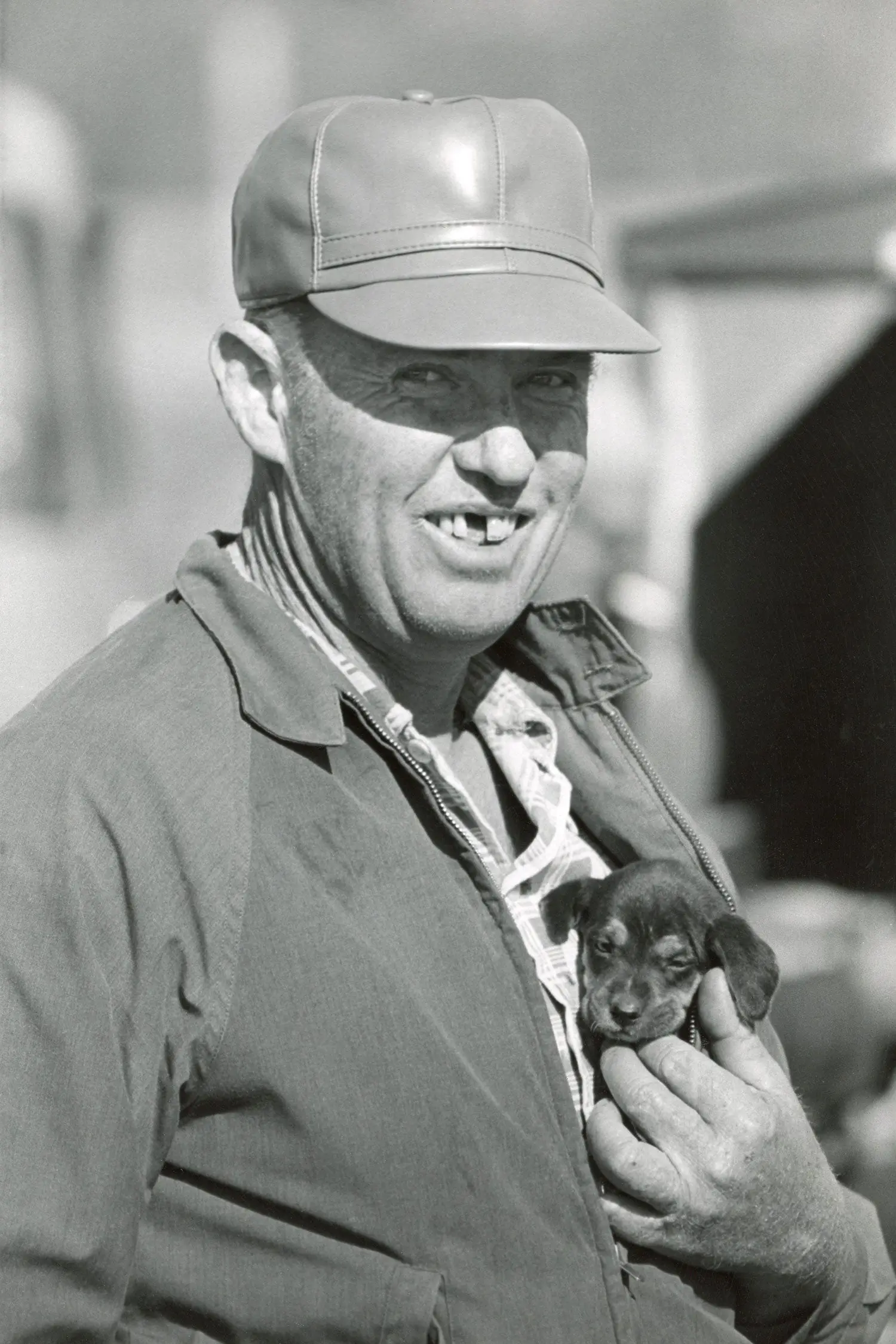 man with beagle puppy