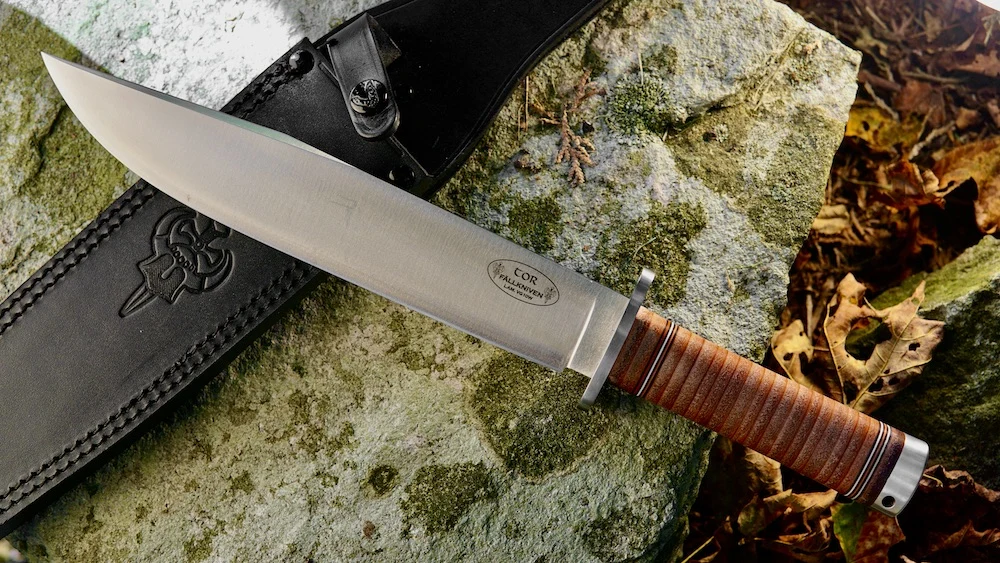 Fallkniven NL1L Thor Bowie Knife lying on rock