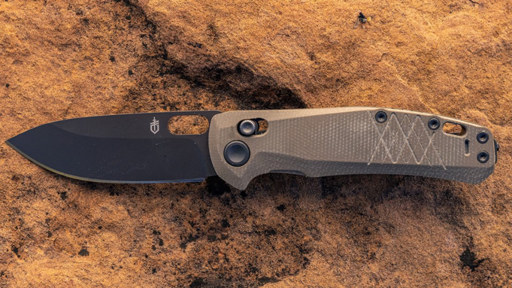 Gerber Gear folding knife sitting on rock