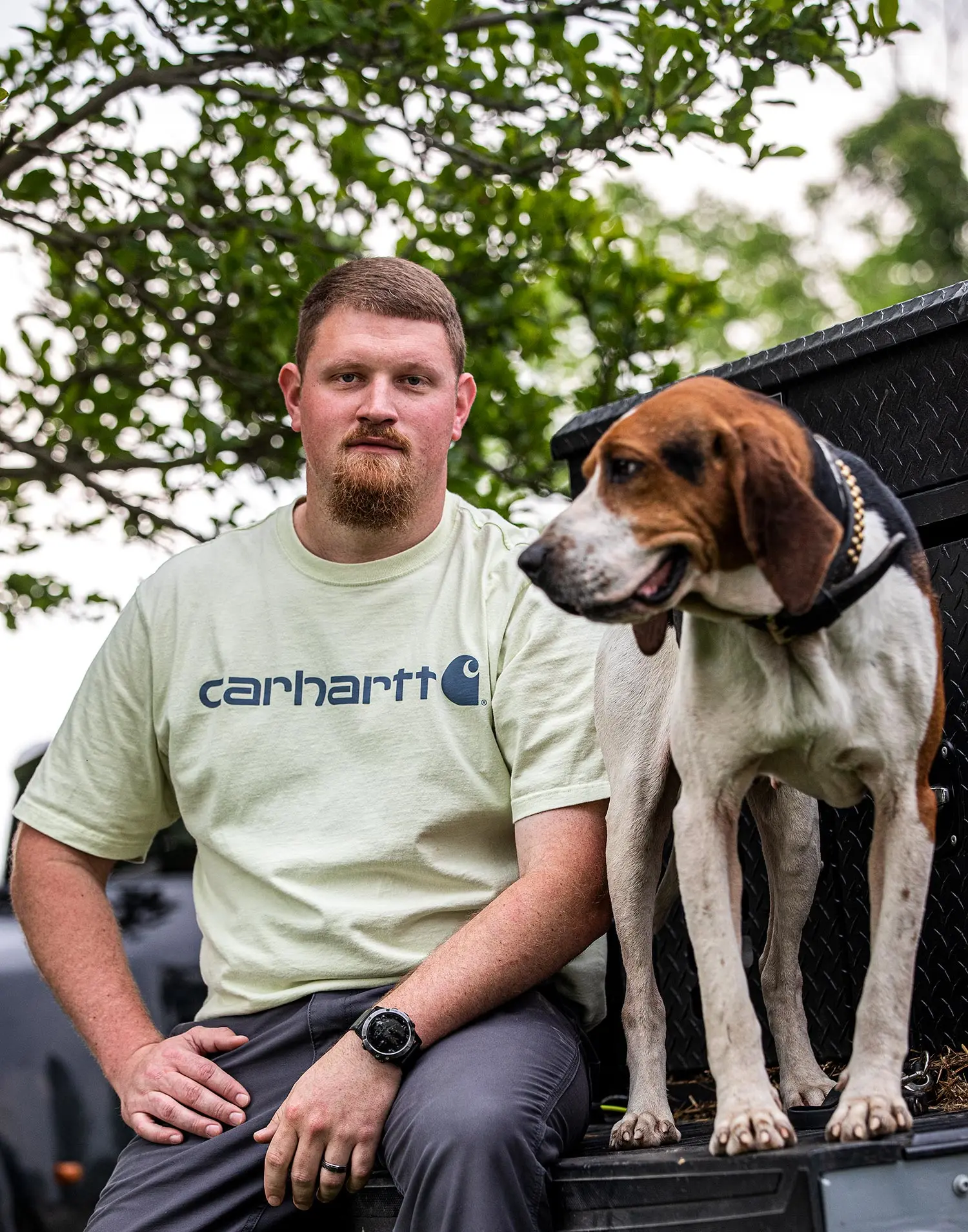 Austin Gentry poses with hound Conor McGregor