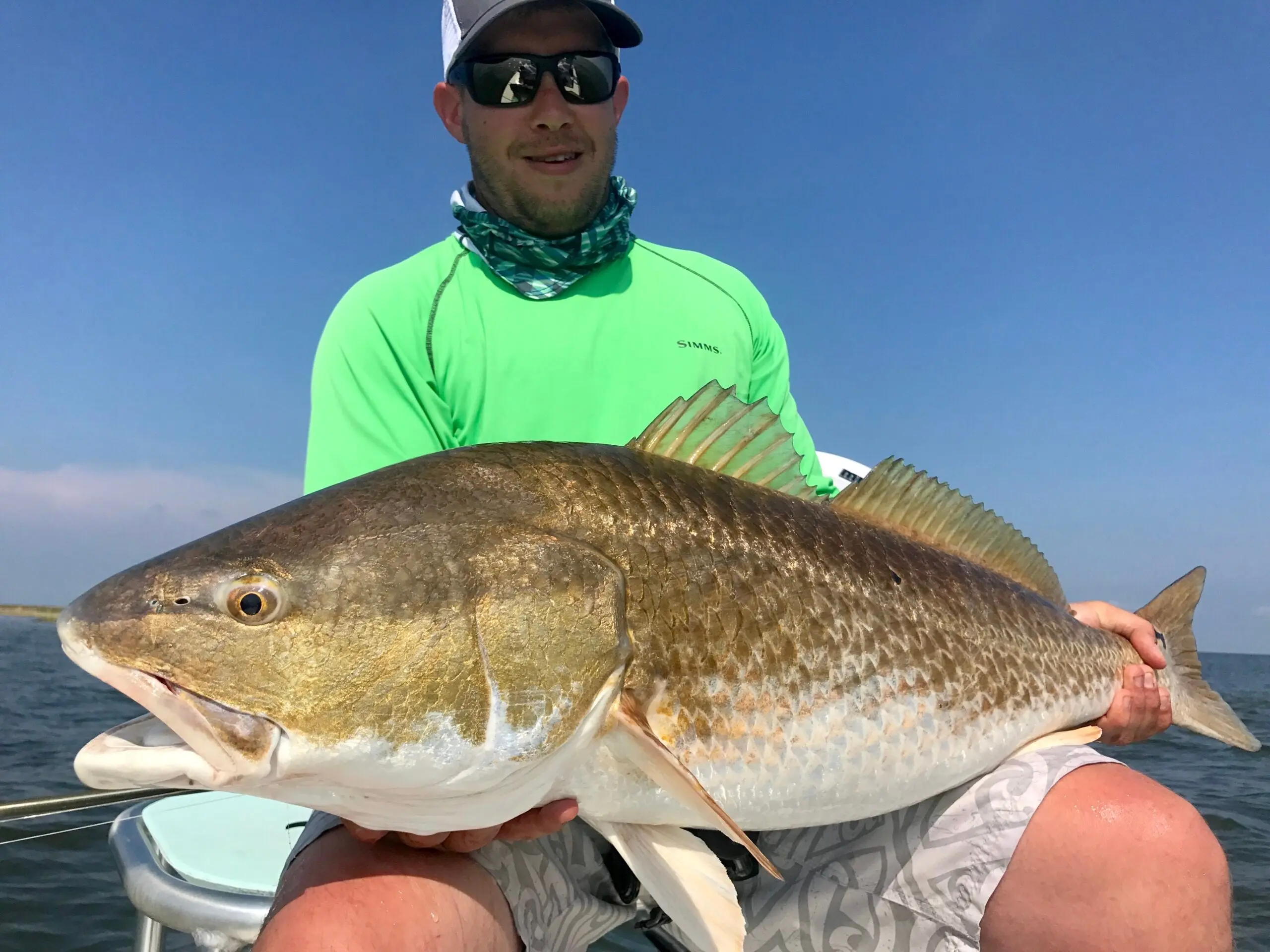 photo of angler redfish fishing