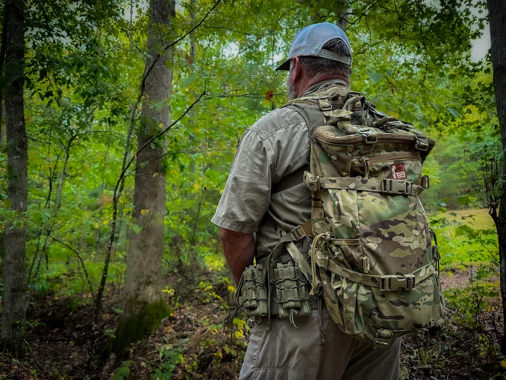 Man wearing Hill People Gear Umlindi Pack in woods