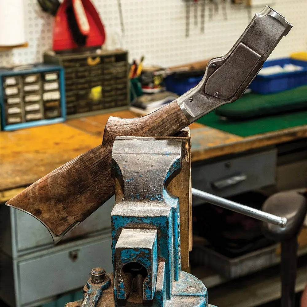 a winchester rifle stock in a shop clamp