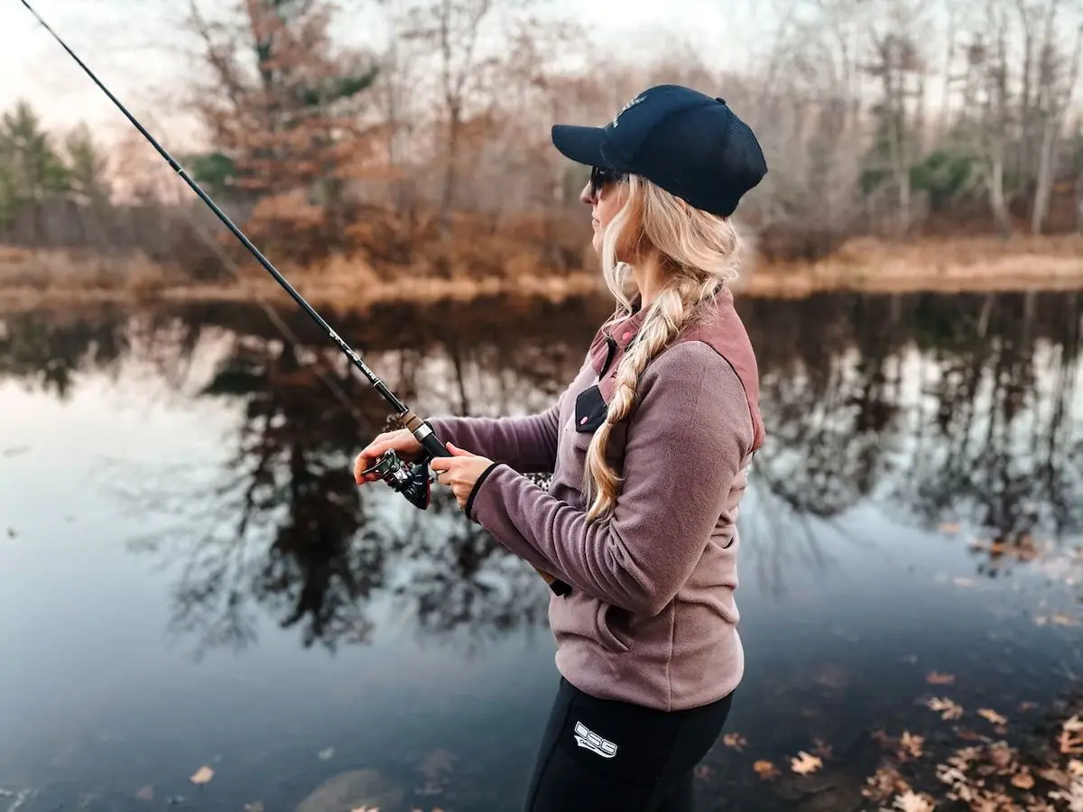 Female anger fishing while wearing DSG apparel