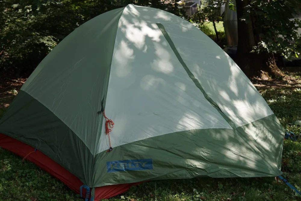 Kelty Discovery Trail Backpacking Tent set up with rain fly